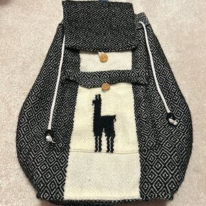 Textile backpack. Alpaca details.